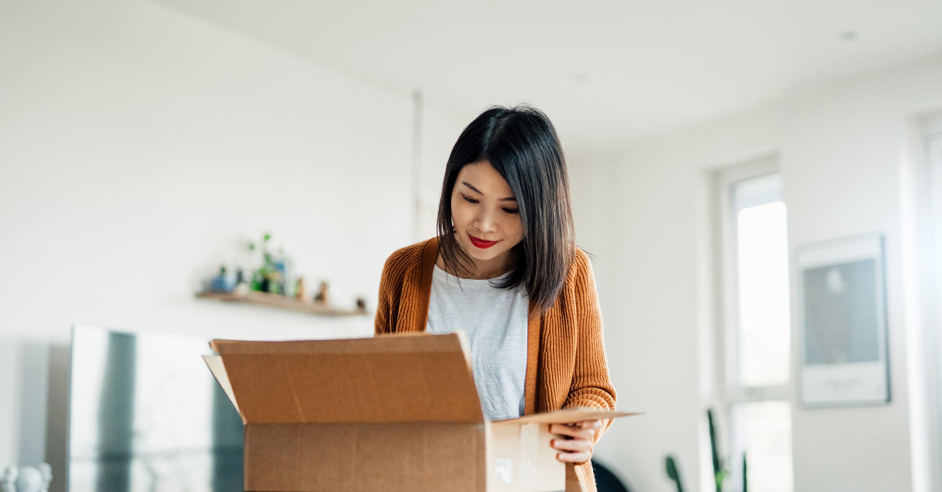 Woman unpacking delivery box