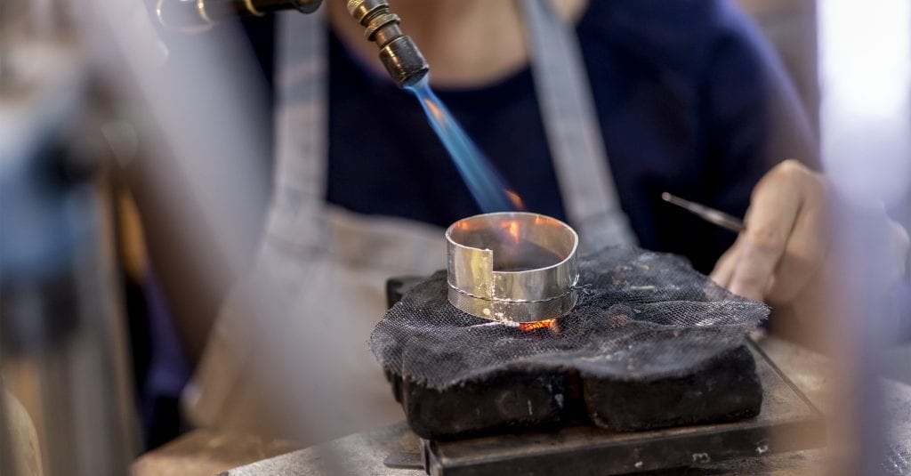 Woman using soldering