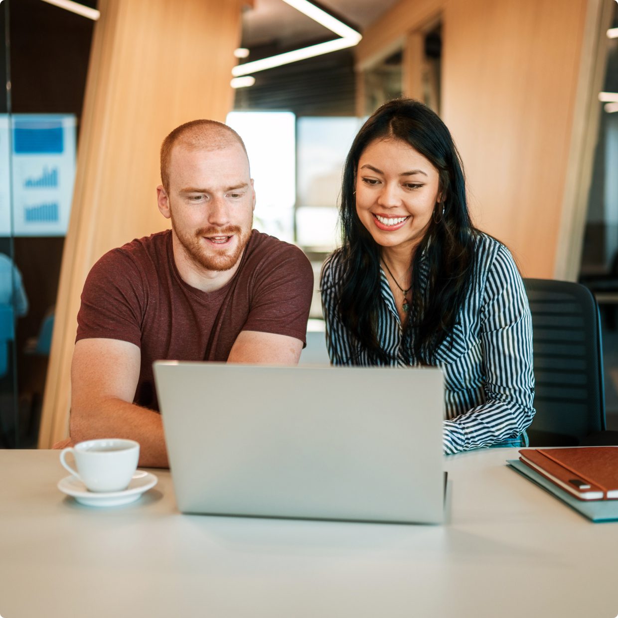 Man and woman working together on laptop