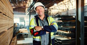 Small business owner working in a factory setting.