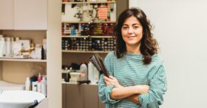 Small business owner standing in a work setting
