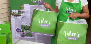 Prospa customer Tita's Cakes working in a retail environment, representing hands-on business success