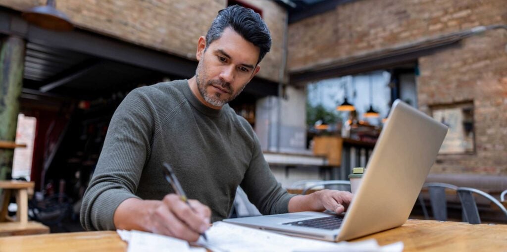 Business owner doing finances in place of work