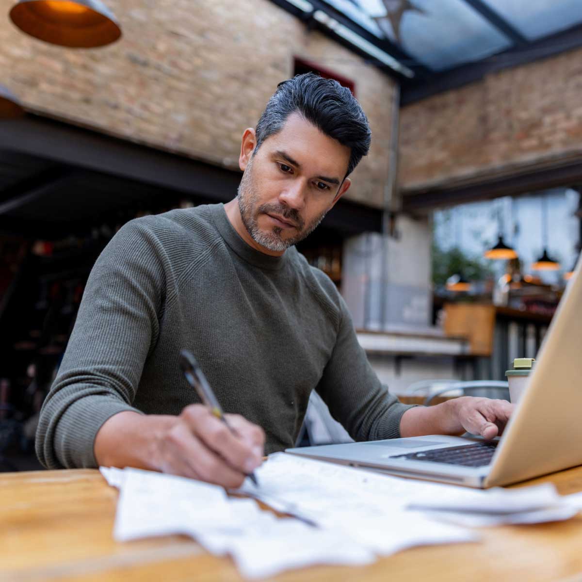 Business owner doing finances in place of work