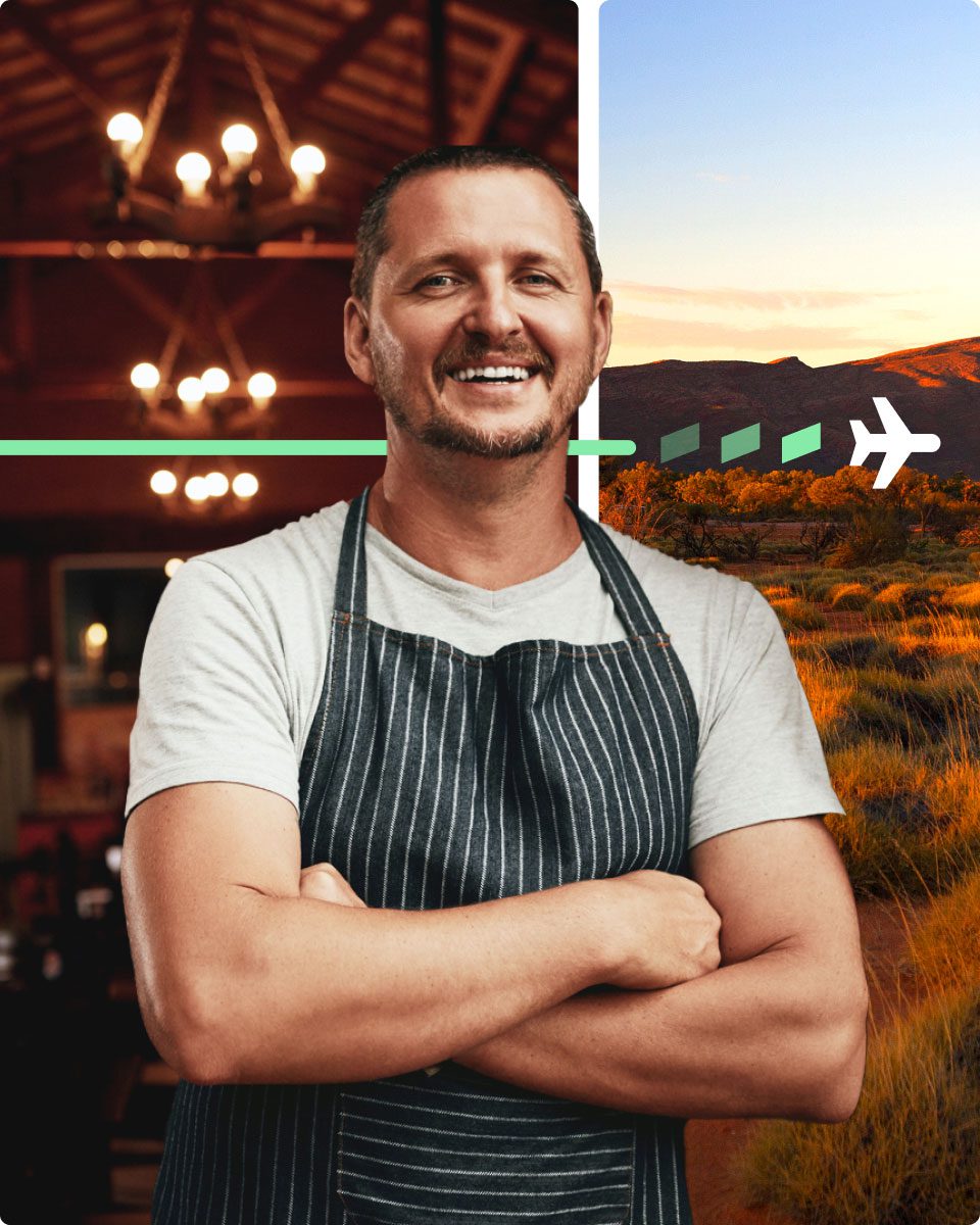 A small business owner wearing an apron stands with arms crossed, set against a split background of a warmly lit hospitality venue and an Australian outback landscape with a plane icon and directional arrow, suggesting business growth and travel rewards.