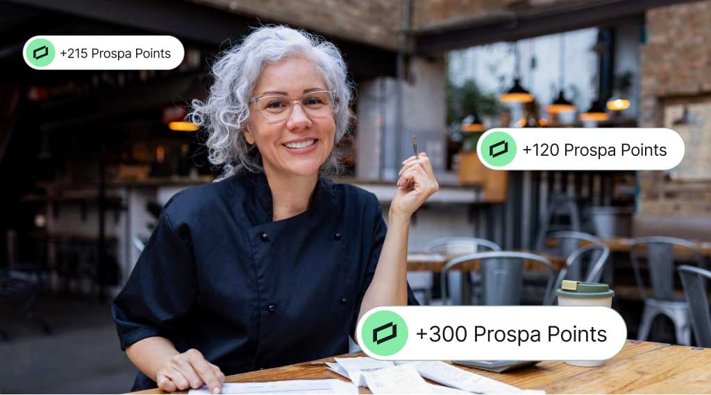 Person seated at a table reviewing paperwork, with Prospa Rewards Points labels displayed around the scene.