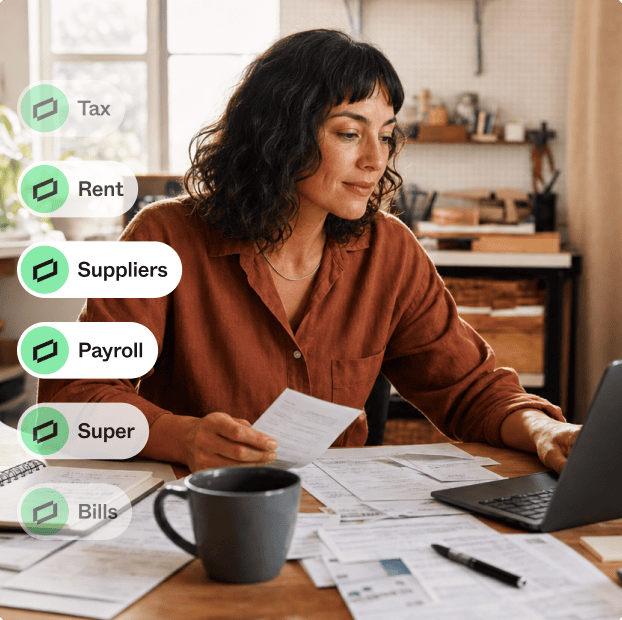 Business owner at a desk reviewing bills on a laptop; labels show Tax, Rent, Suppliers, Payroll, Super and Bills