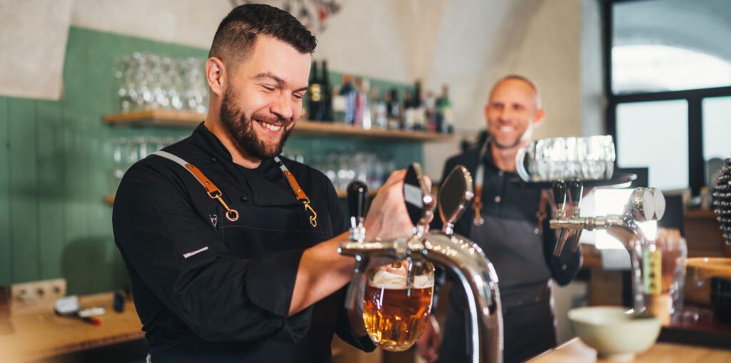 Barmen smiling while working